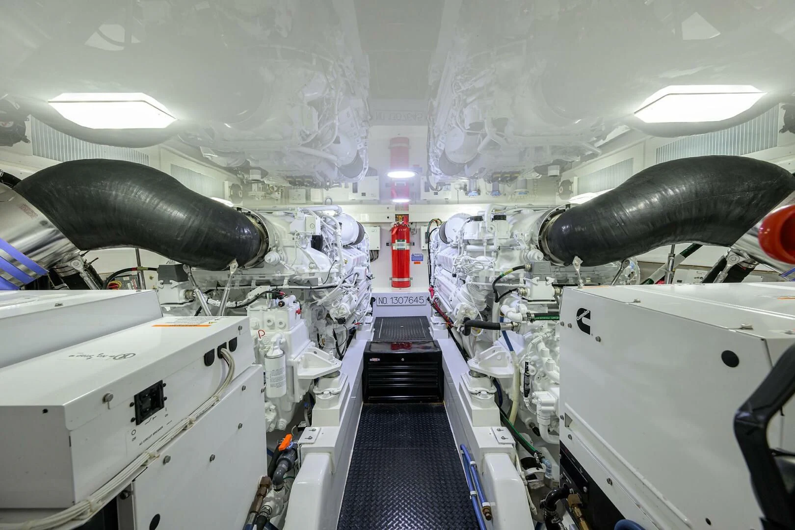 a room with a machine and pipes aboard TEAM MAYHEM Yacht for Sale