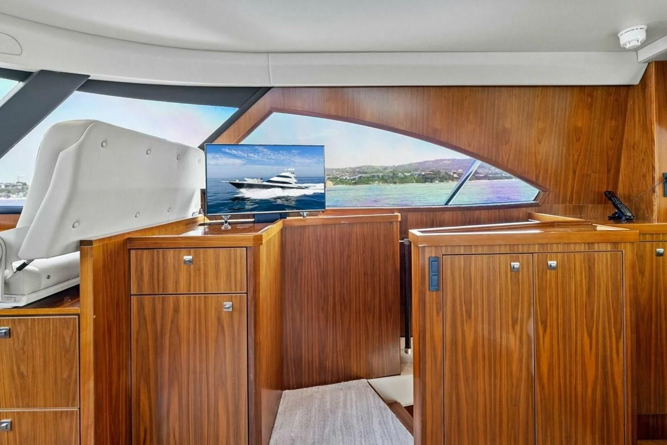 a boat in a wooden room aboard TEAM MAYHEM Yacht for Sale