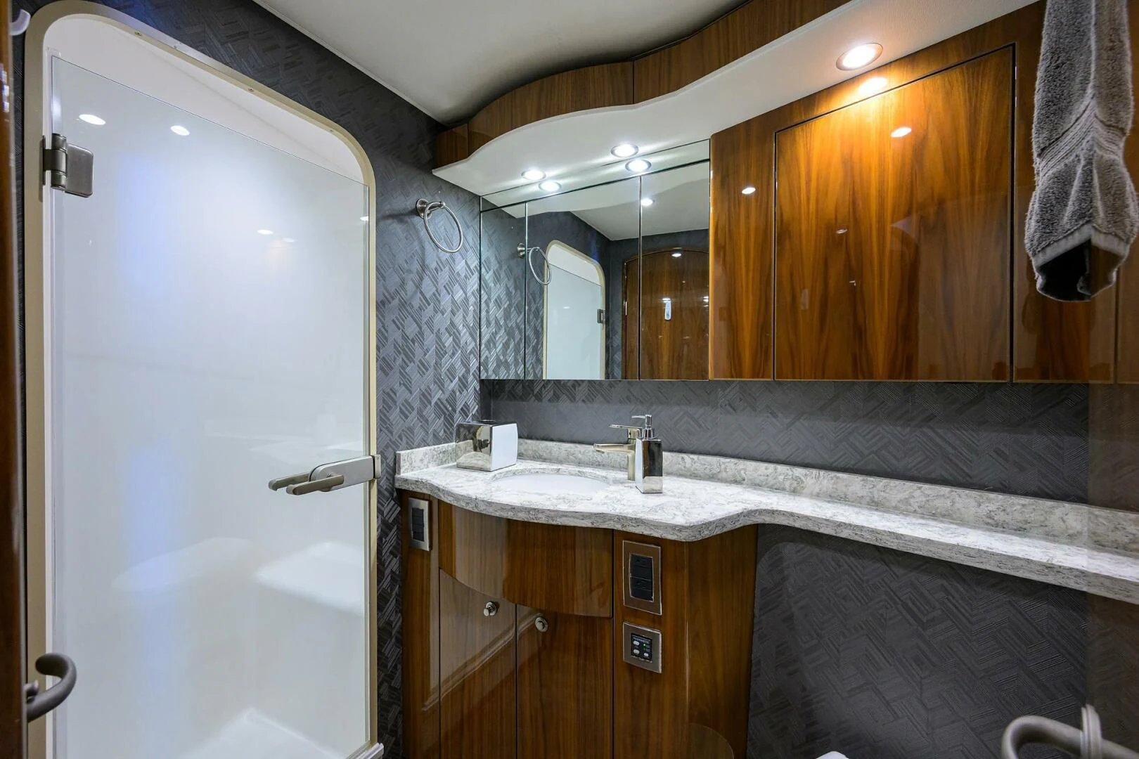 a bathroom with a large mirror aboard TEAM MAYHEM Yacht for Sale