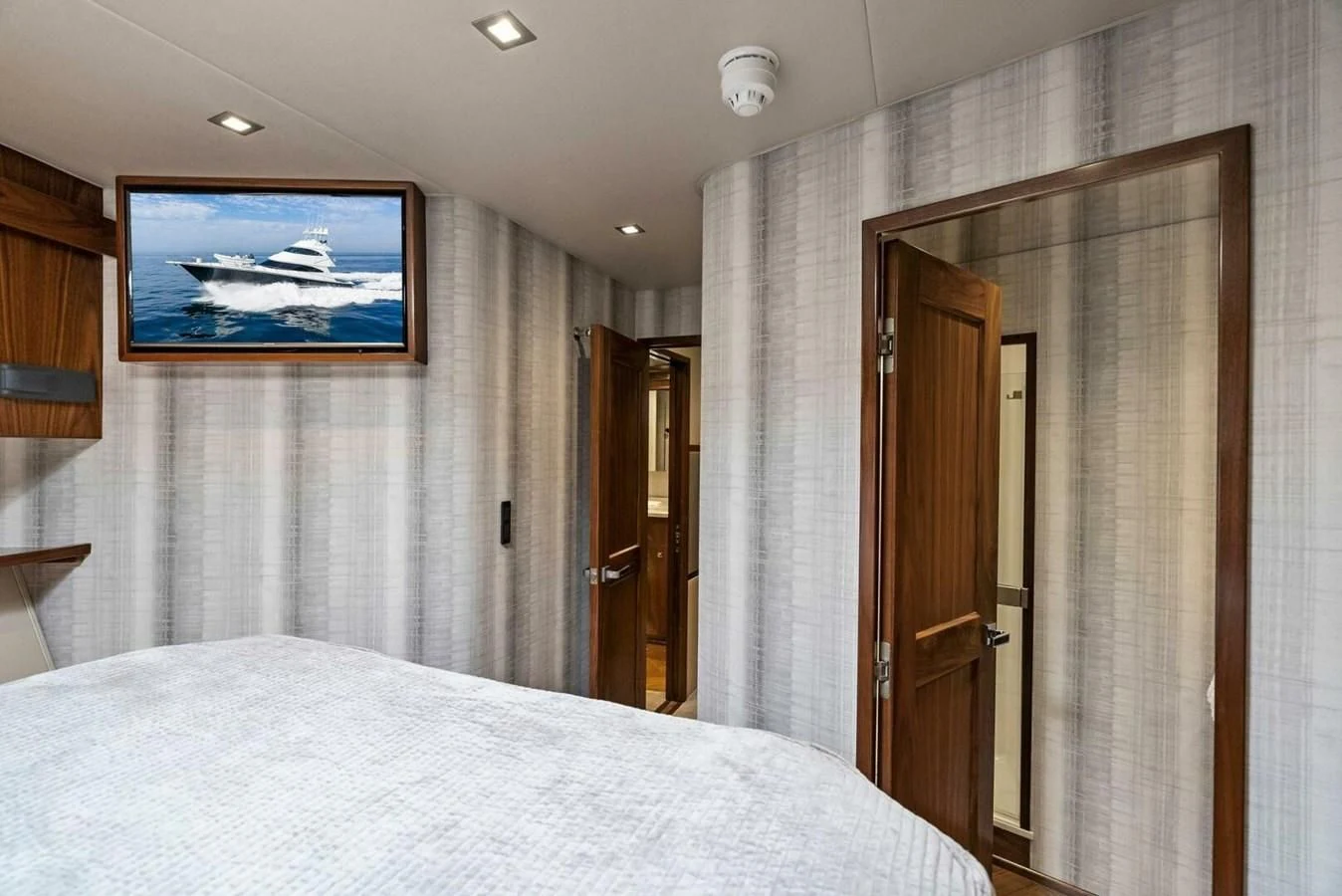 a hotel room with a bed aboard TEAM MAYHEM Yacht for Sale