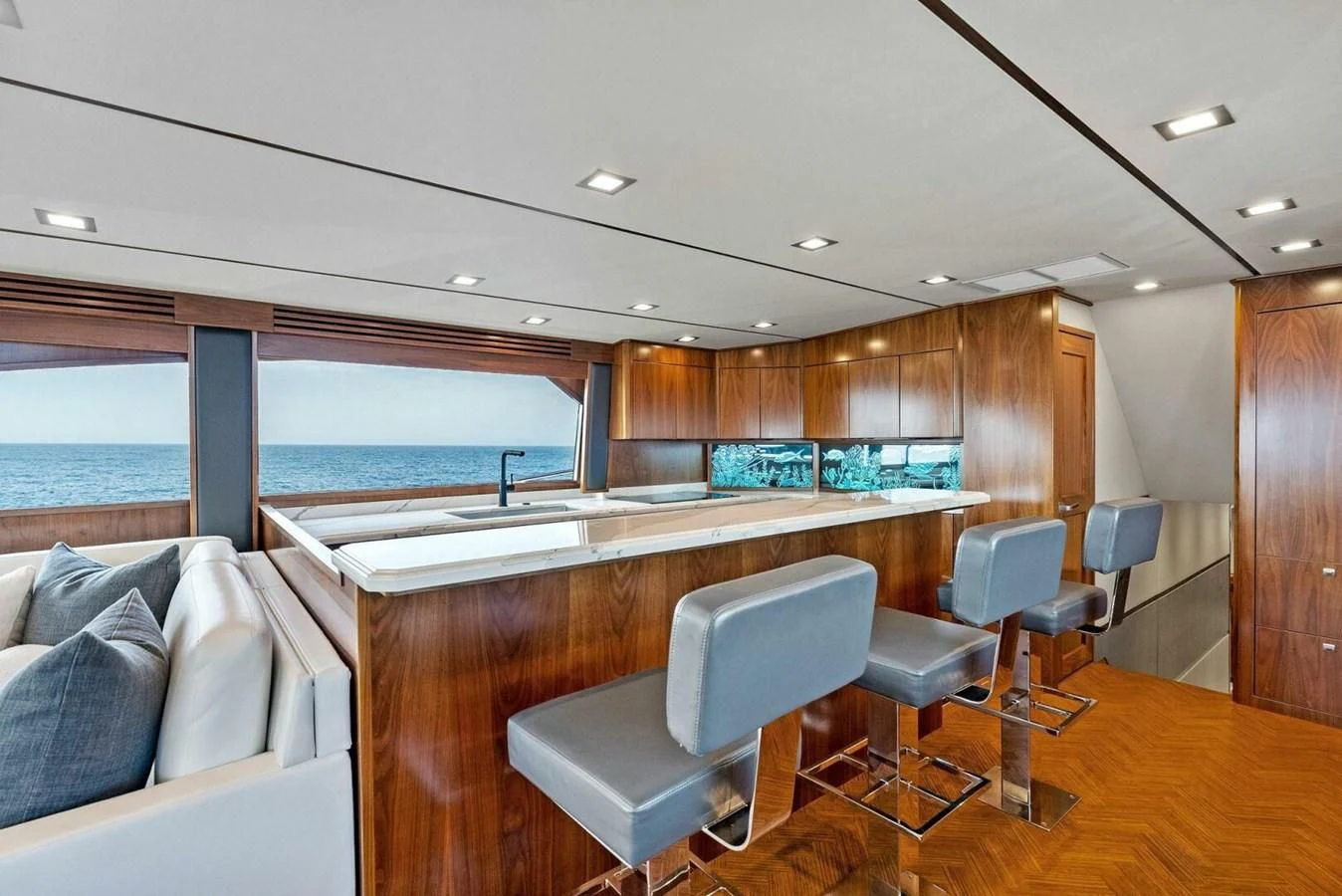 a large room with a large window and a view of the ocean aboard TEAM MAYHEM Yacht for Sale