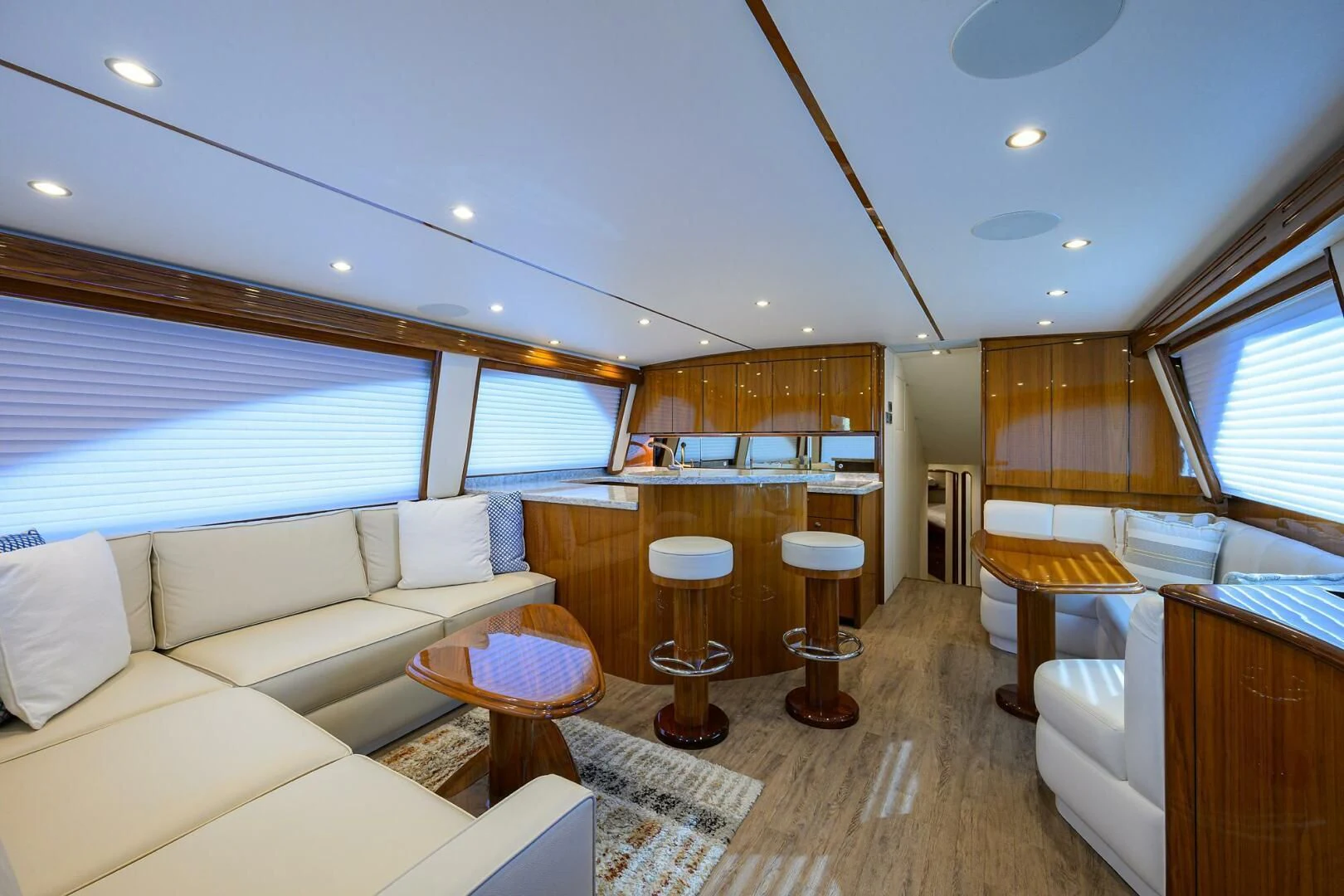 a living room with a large window aboard TEAM MAYHEM Yacht for Sale