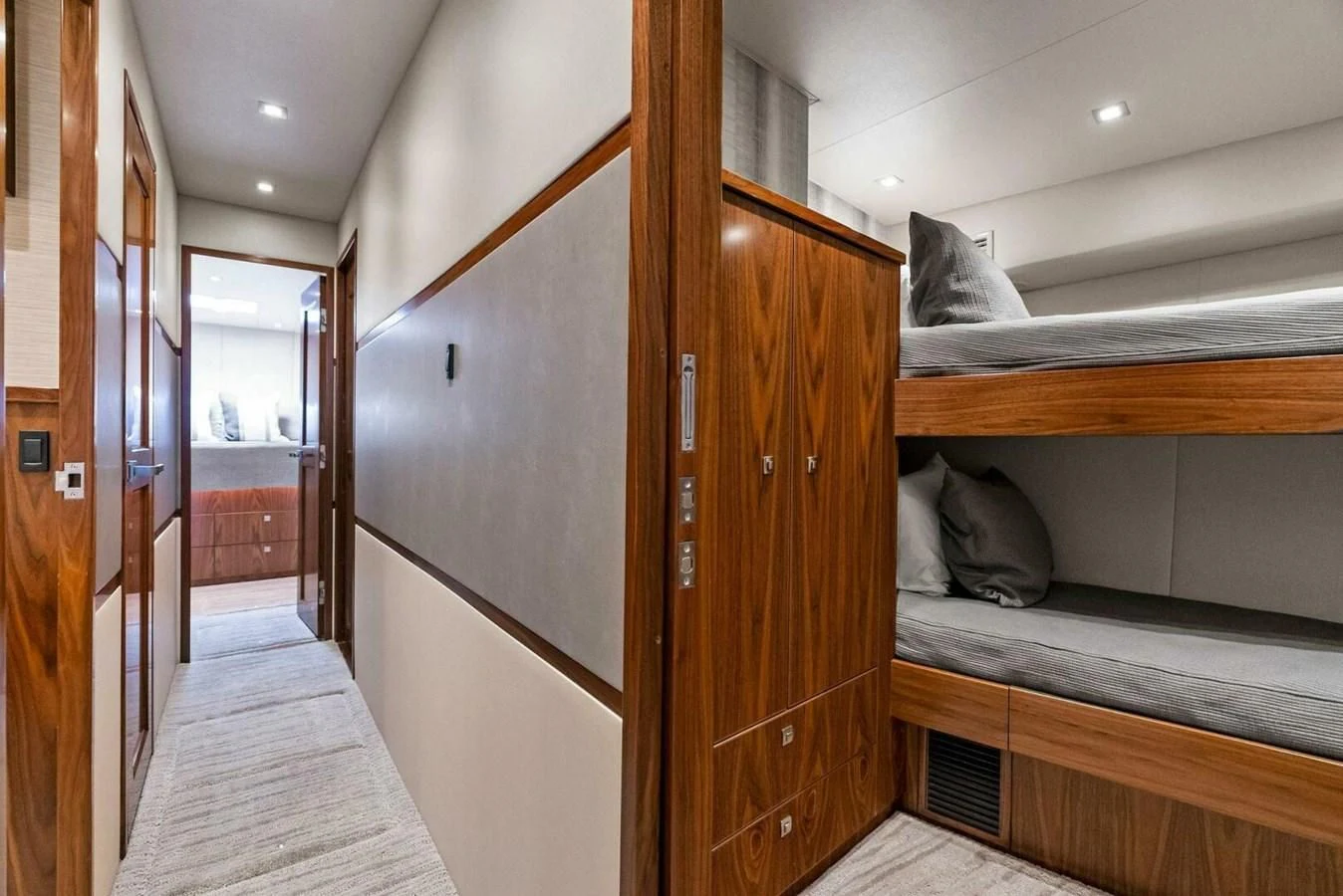 a cat sitting on a bed aboard TEAM MAYHEM Yacht for Sale