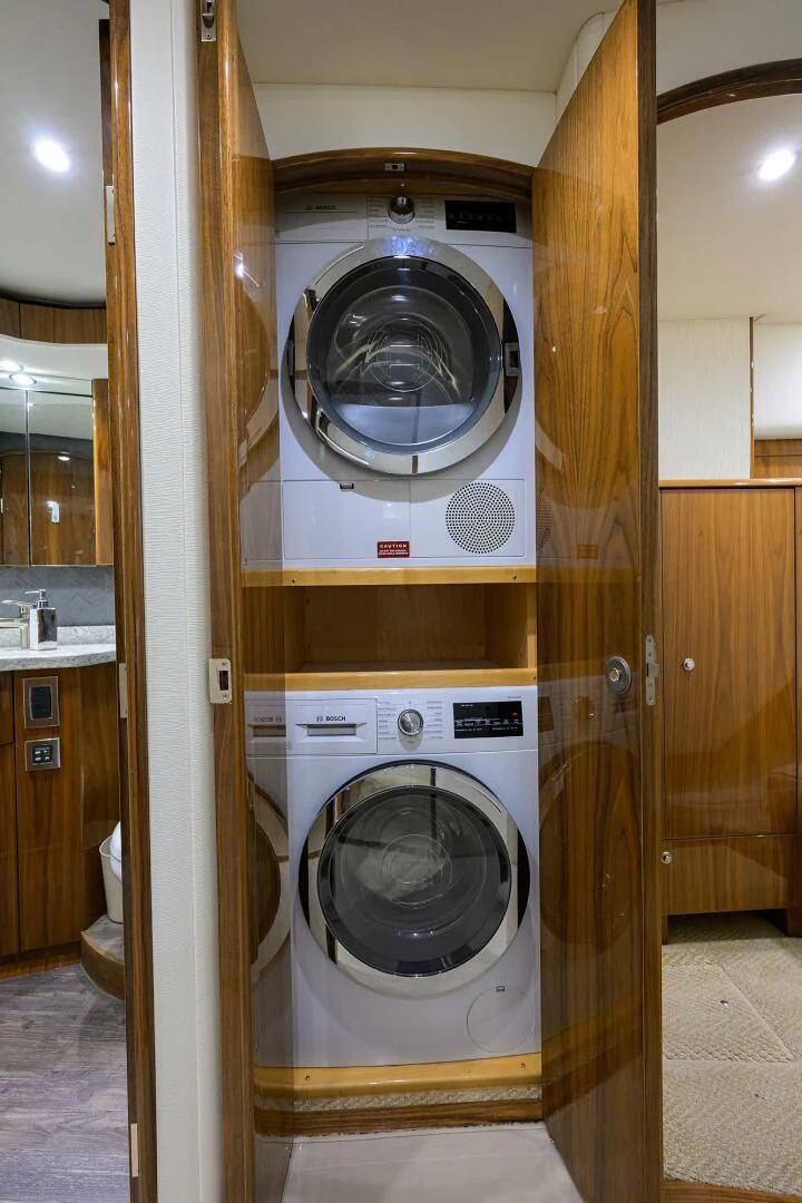 a washing machine in a room aboard TEAM MAYHEM Yacht for Sale