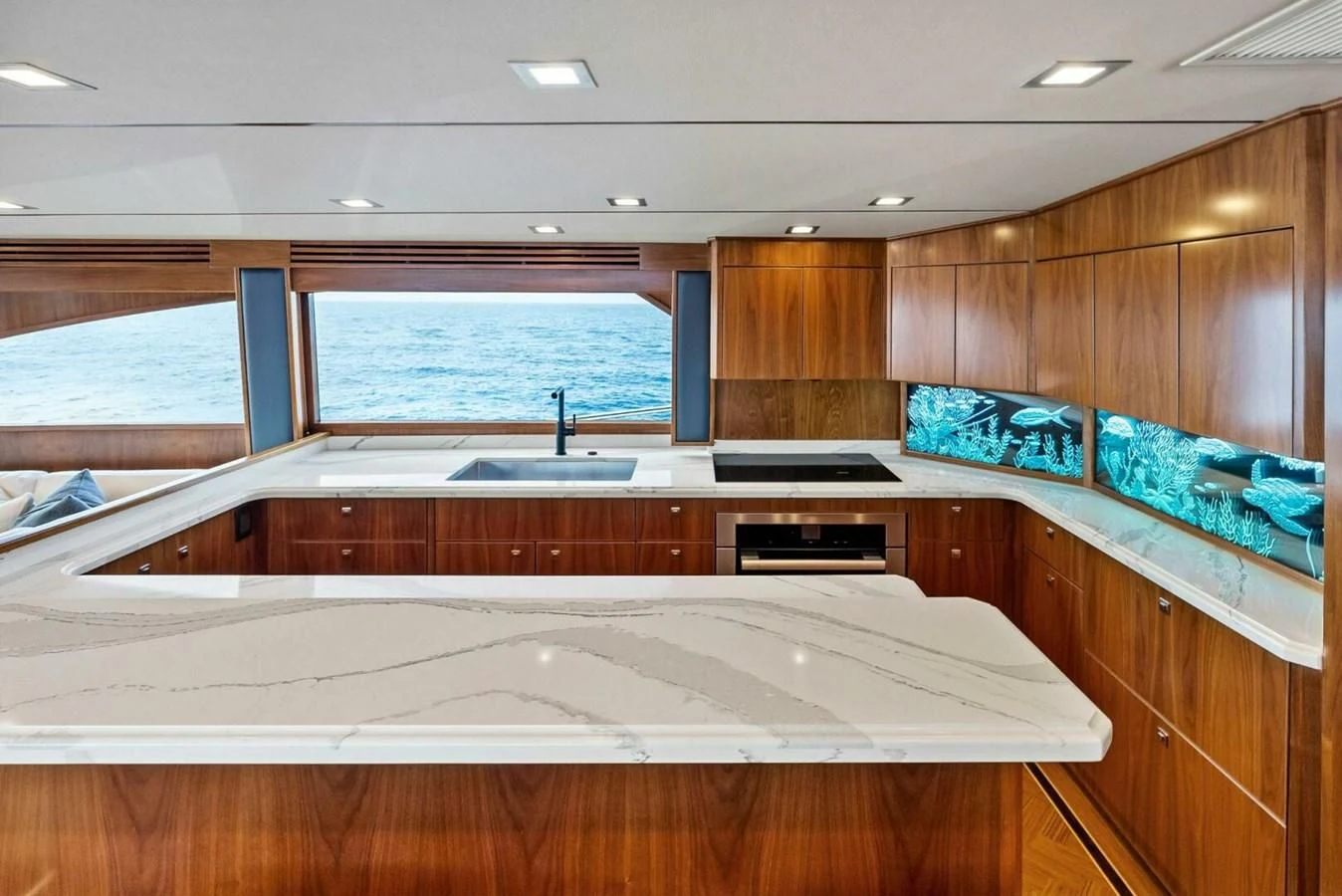 a kitchen with a large window aboard TEAM MAYHEM Yacht for Sale
