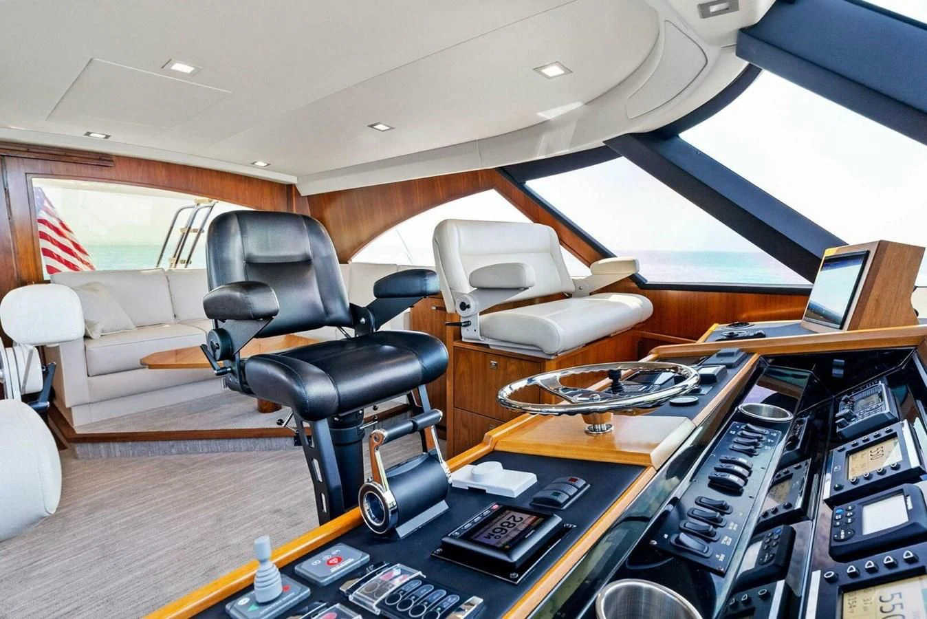 a room with a desk and chairs aboard TEAM MAYHEM Yacht for Sale