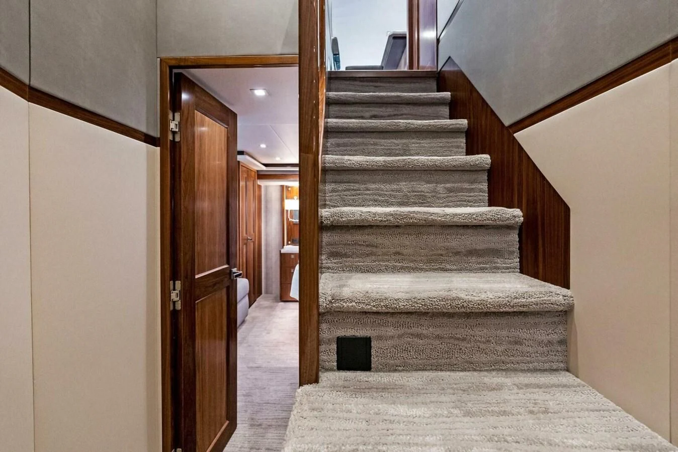 a staircase in a house aboard TEAM MAYHEM Yacht for Sale