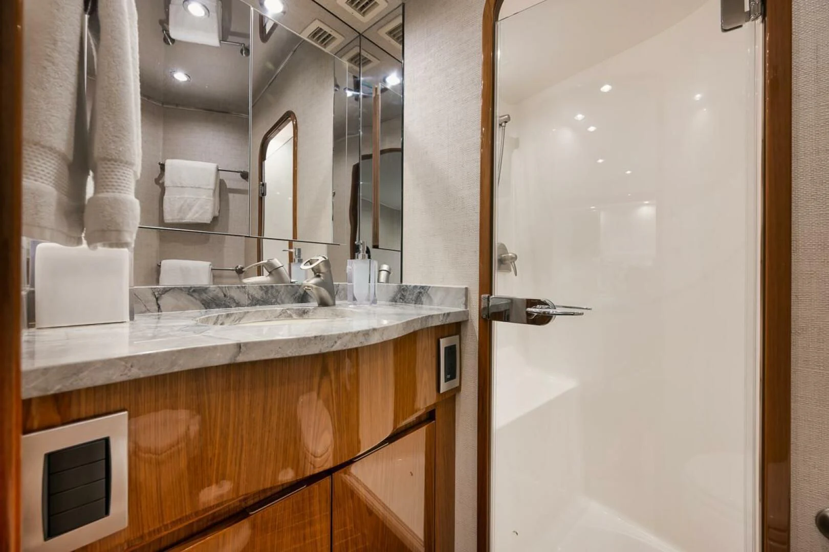 a bathroom with a sink and mirror aboard DOC Z Yacht for Sale