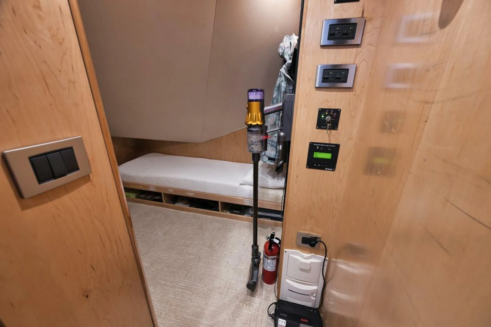 a room with a bed and a desk aboard DOC Z Yacht for Sale