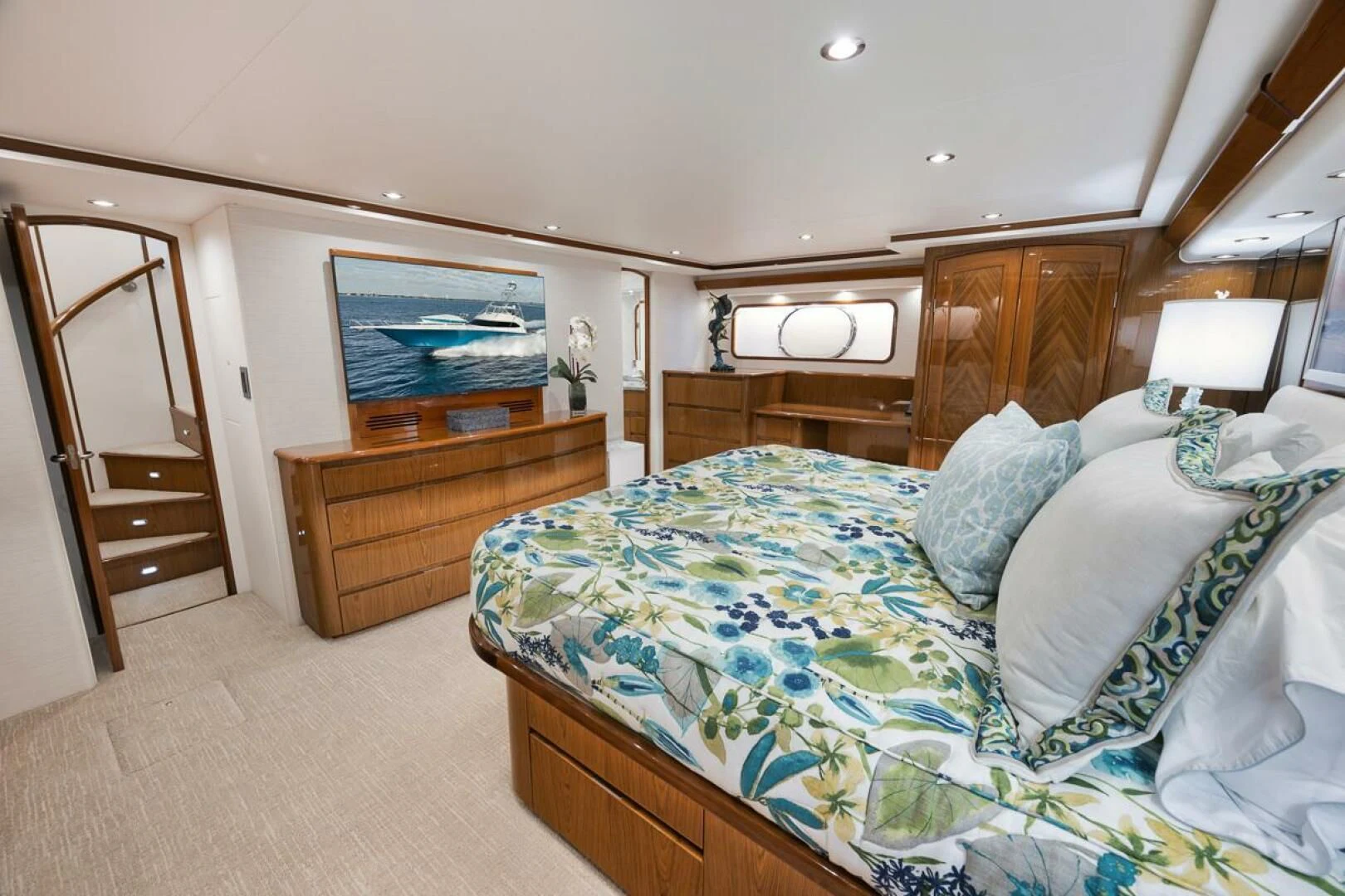 a bedroom with a bed and a television aboard DOC Z Yacht for Sale