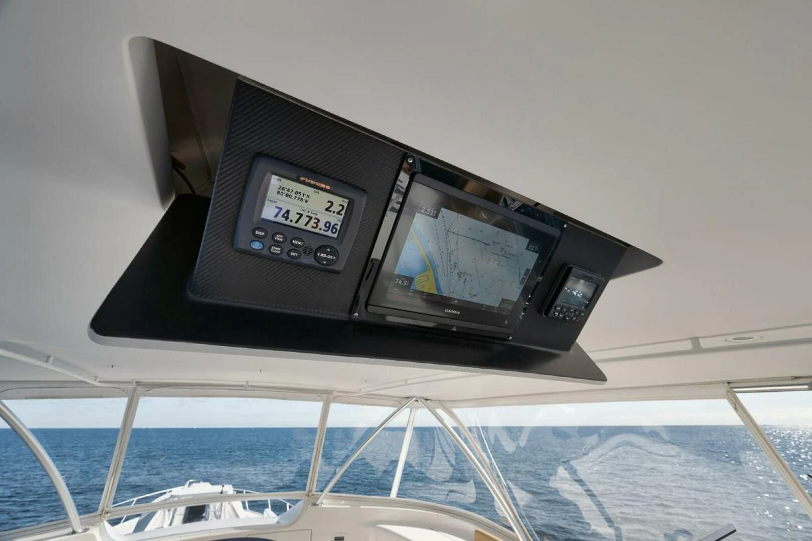 a black electronic device on a white surface aboard DOC Z Yacht for Sale