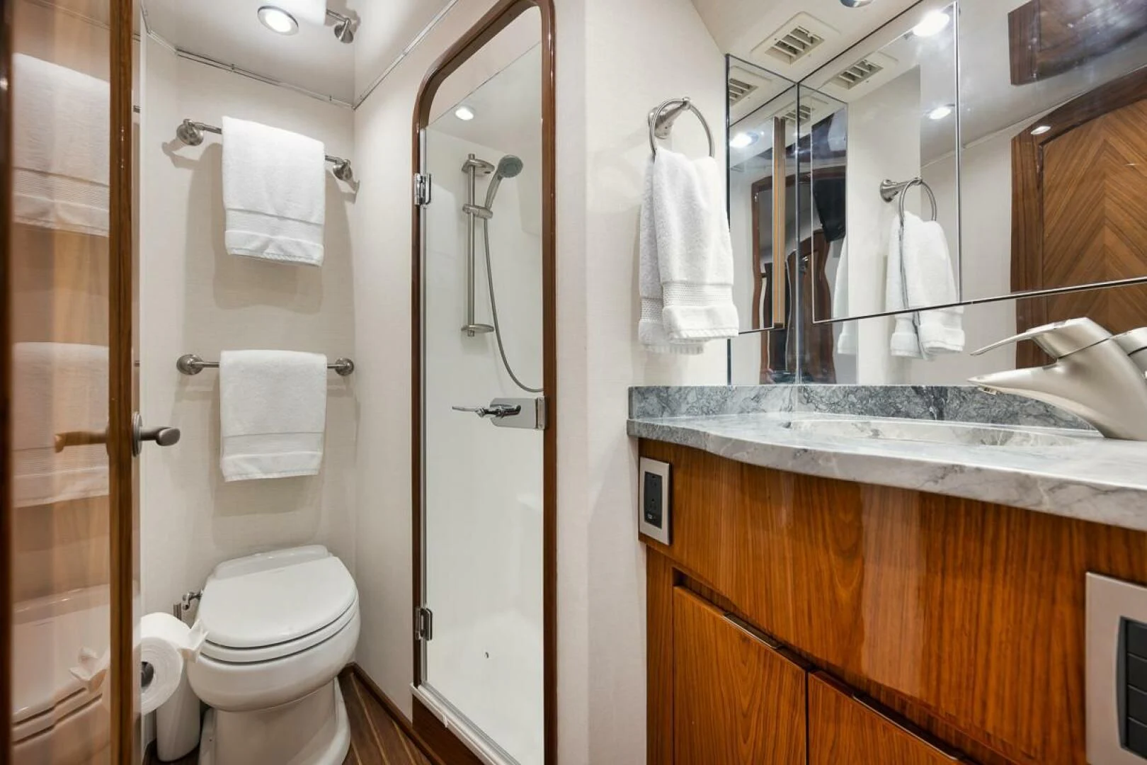 a bathroom with a toilet and a sink aboard DOC Z Yacht for Sale