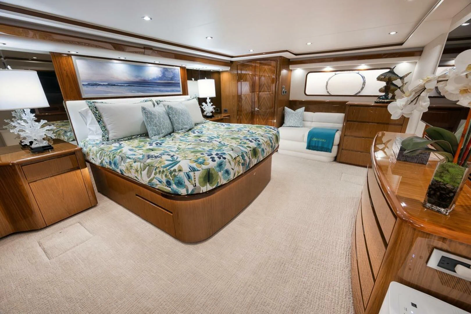 a bedroom with a bed and a desk aboard DOC Z Yacht for Sale