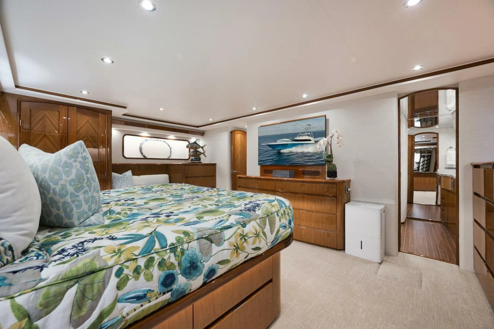a bedroom with a bed and a television aboard DOC Z Yacht for Sale