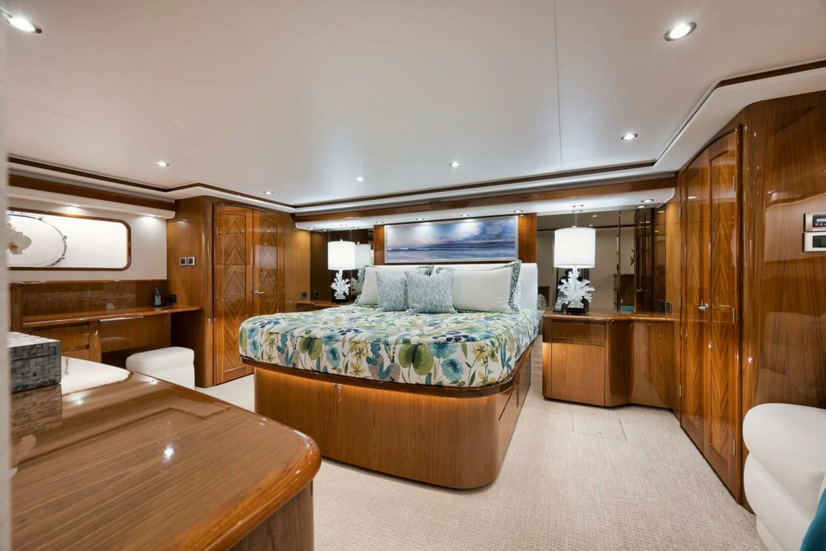 a bedroom with a bed and a desk aboard DOC Z Yacht for Sale