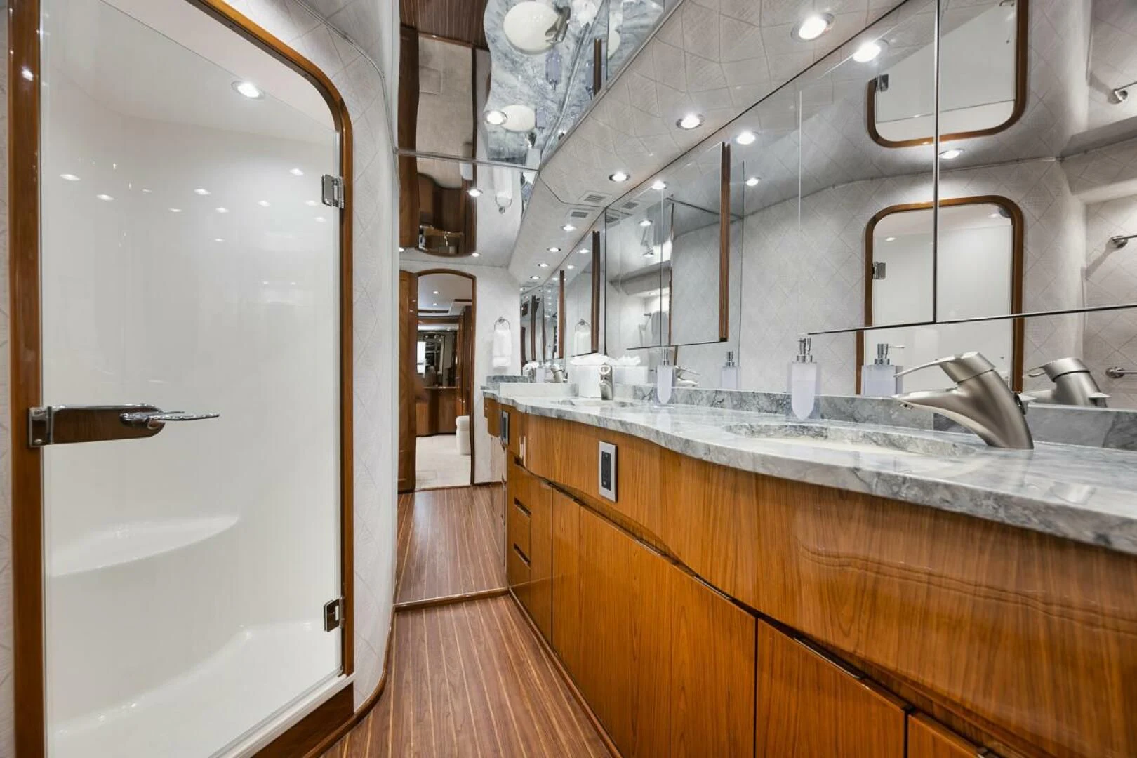 a bathroom with a large mirror aboard DOC Z Yacht for Sale