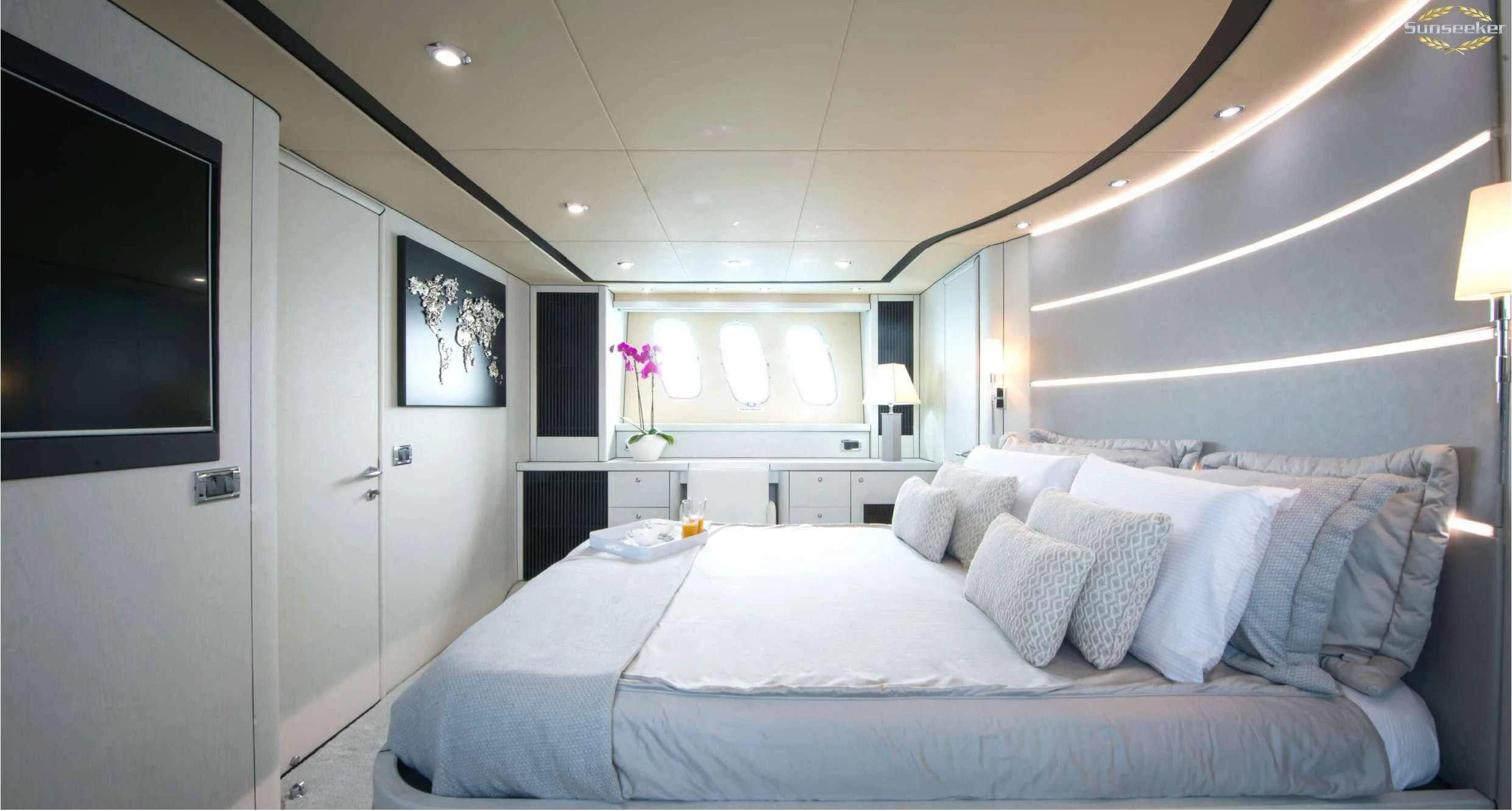 a large bed in a room aboard LIGHT BLUE Yacht for Sale