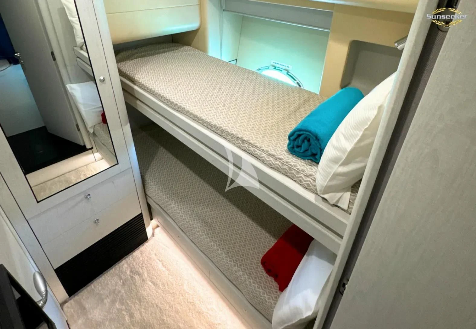 a bed with a blue blanket aboard LIGHT BLUE Yacht for Sale