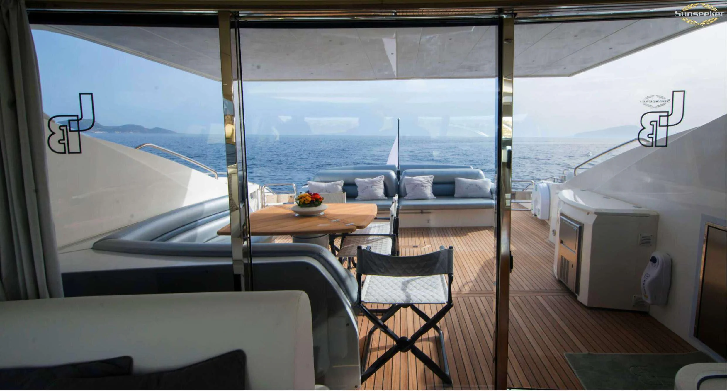 a room with a table and chairs aboard LIGHT BLUE Yacht for Sale