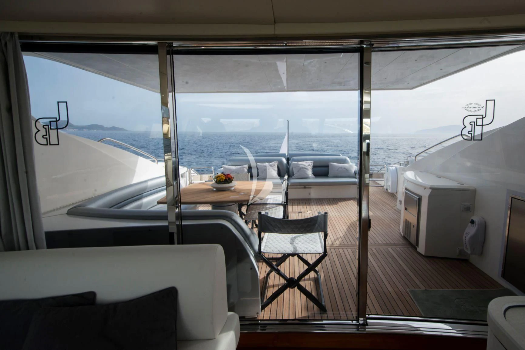 a room with a table and chairs aboard LIGHT BLUE Yacht for Sale