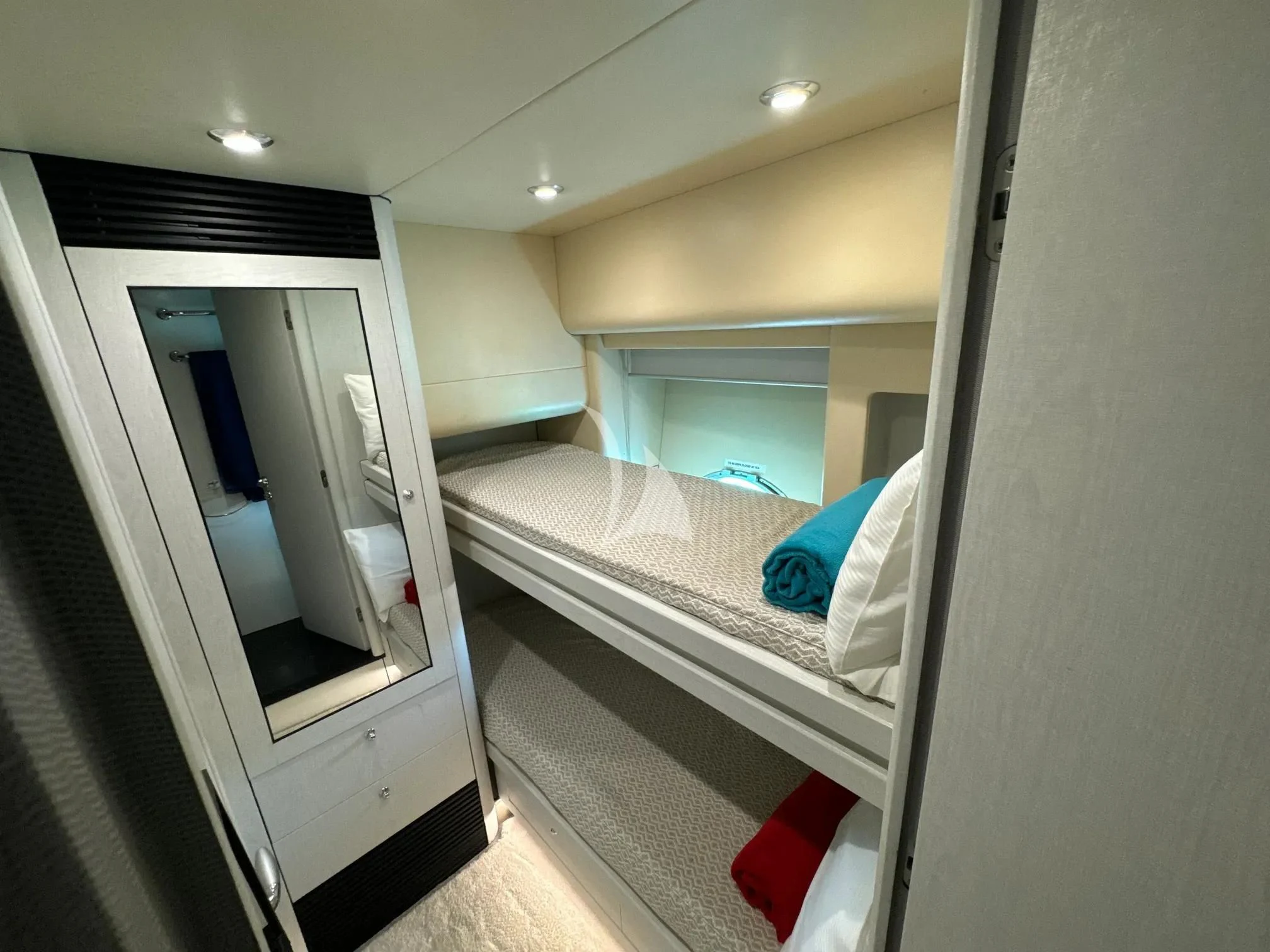 a bathroom with a bed and a mirror aboard LIGHT BLUE Yacht for Sale