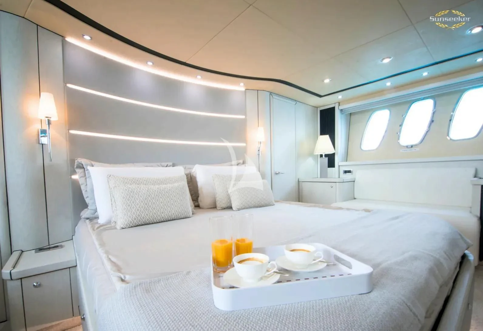a bed with white sheets and pillows aboard LIGHT BLUE Yacht for Sale