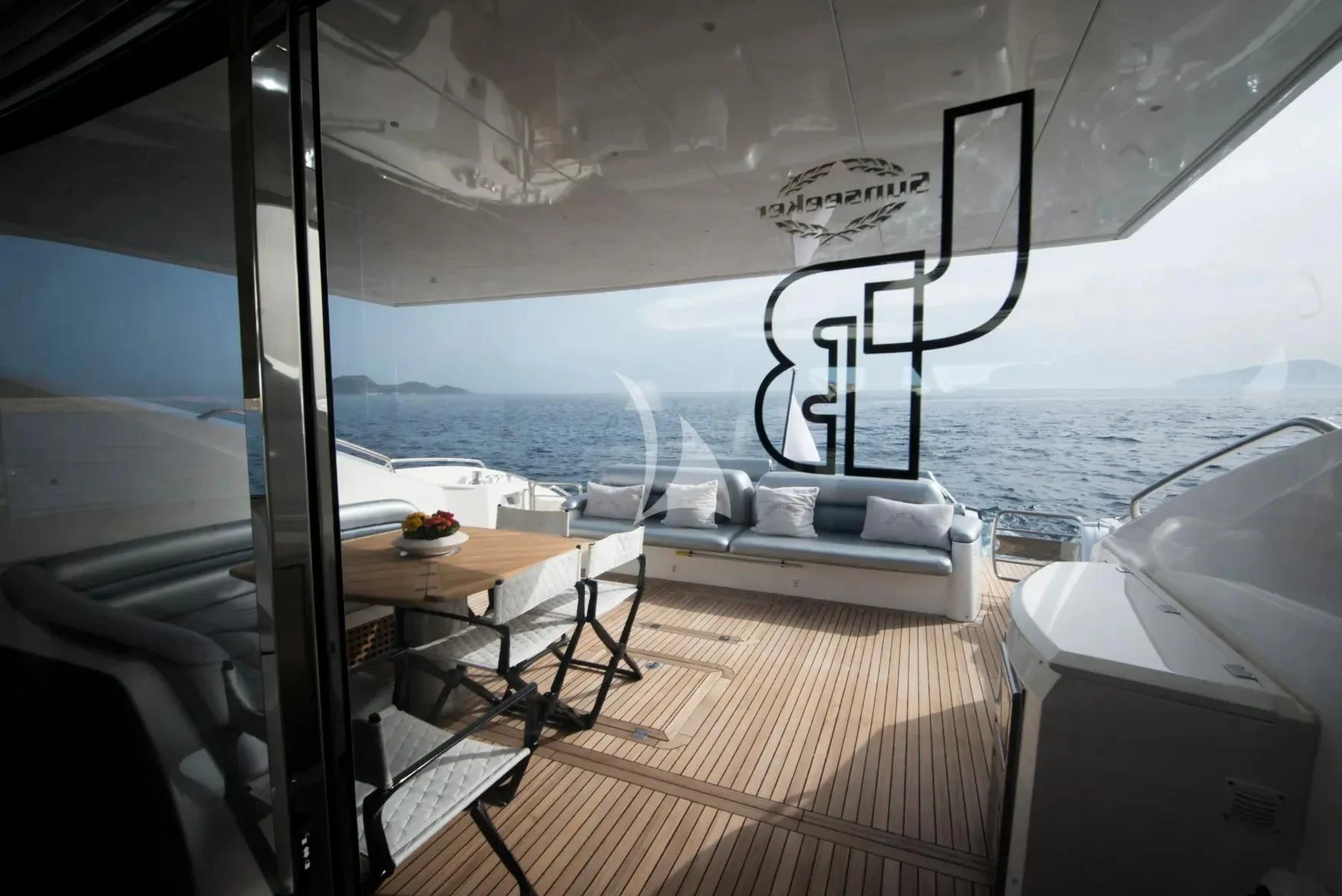 a room with a table and chairs aboard LIGHT BLUE Yacht for Sale