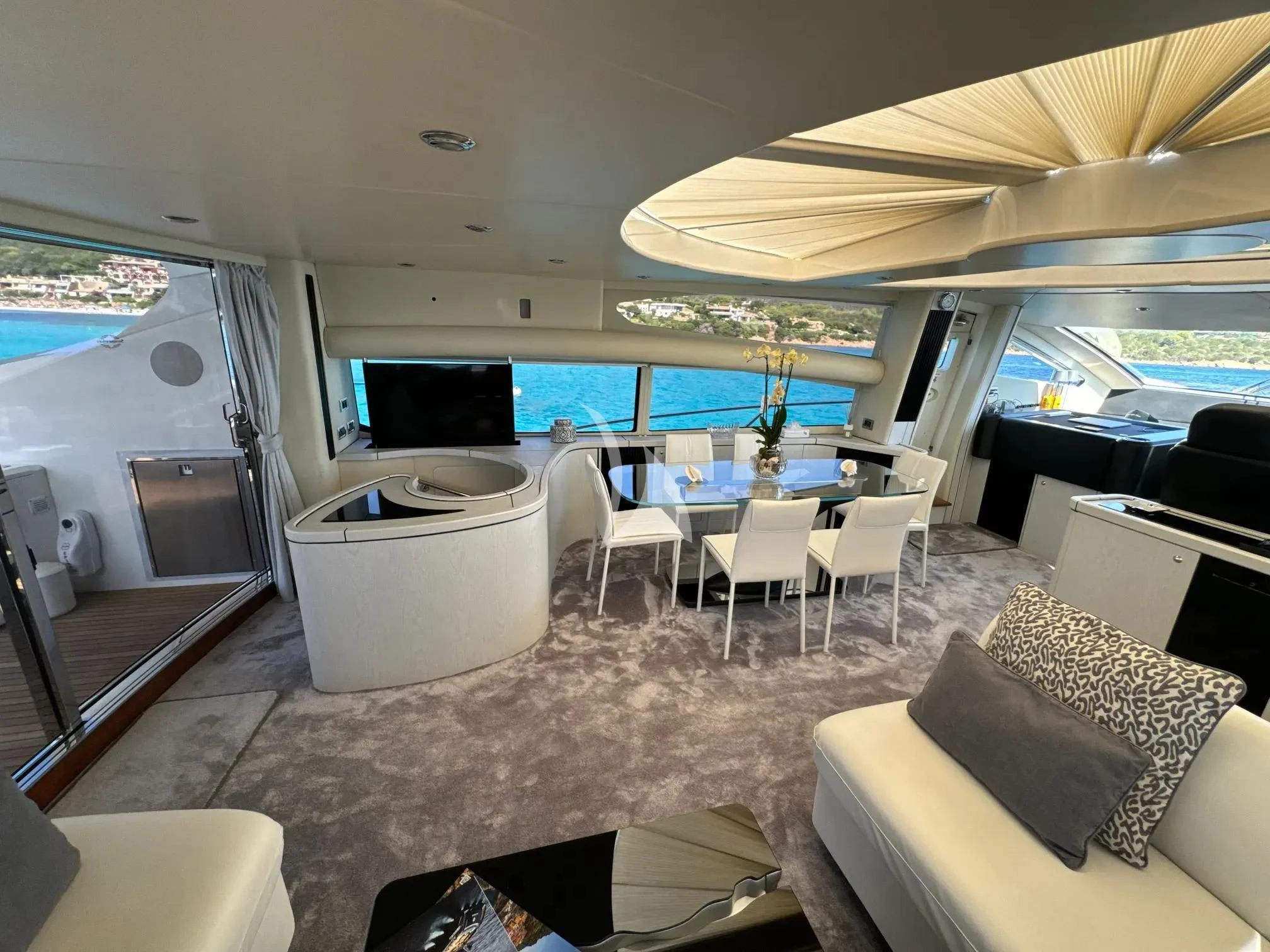 a room with a table and chairs aboard LIGHT BLUE Yacht for Sale