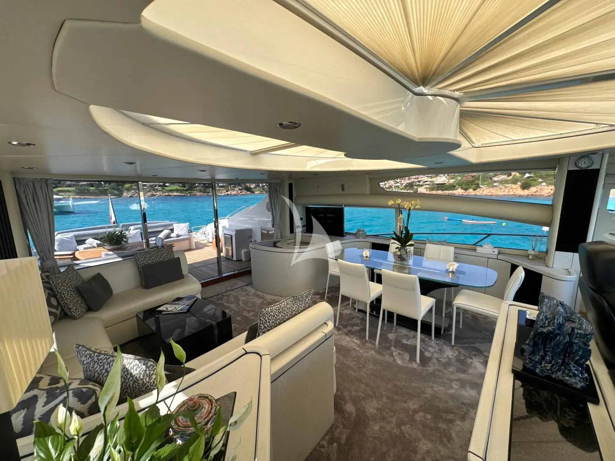 a room with a view of the ocean and the deck aboard LIGHT BLUE Yacht for Sale