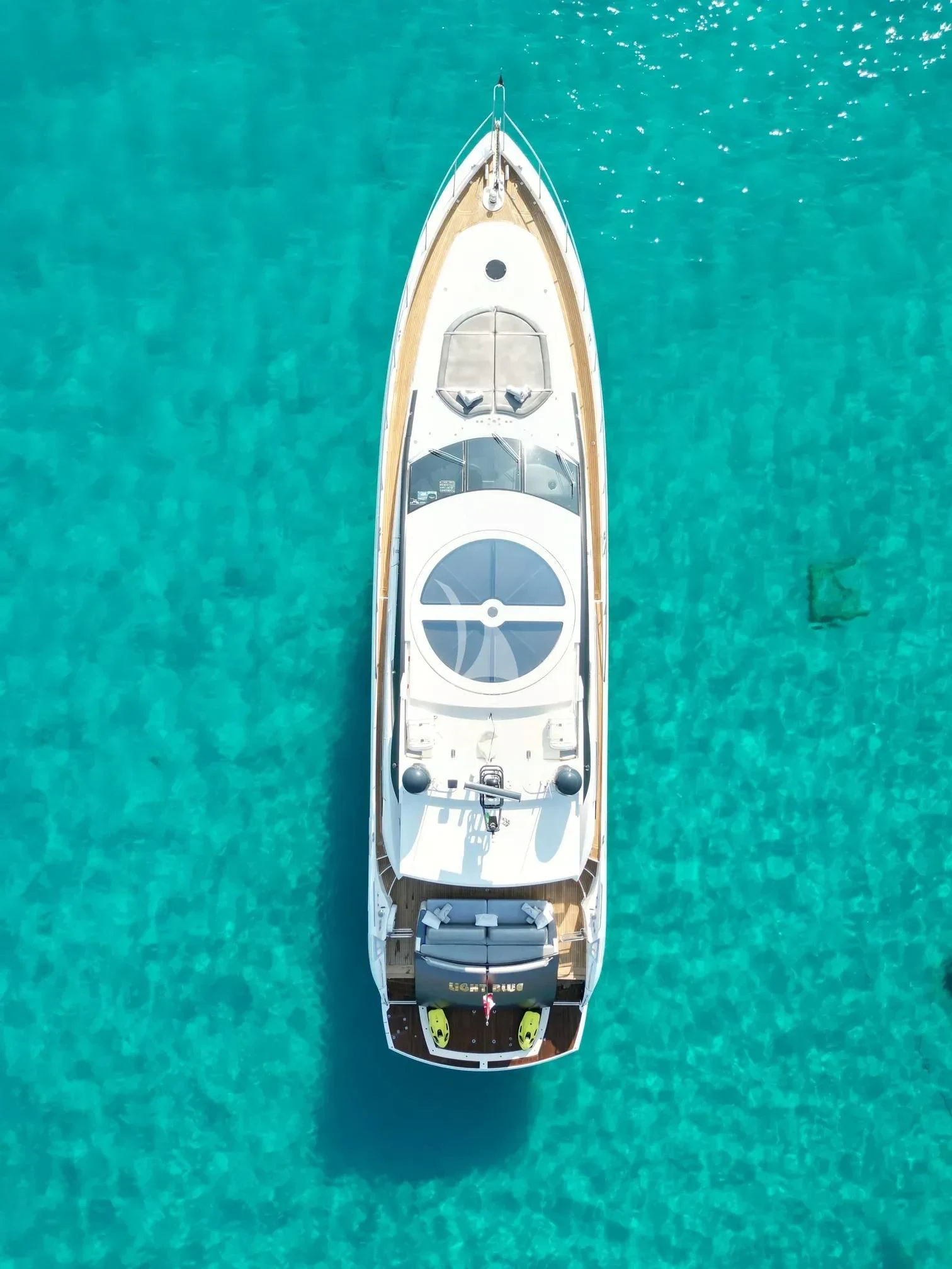 a white and silver boat aboard LIGHT BLUE Yacht for Sale