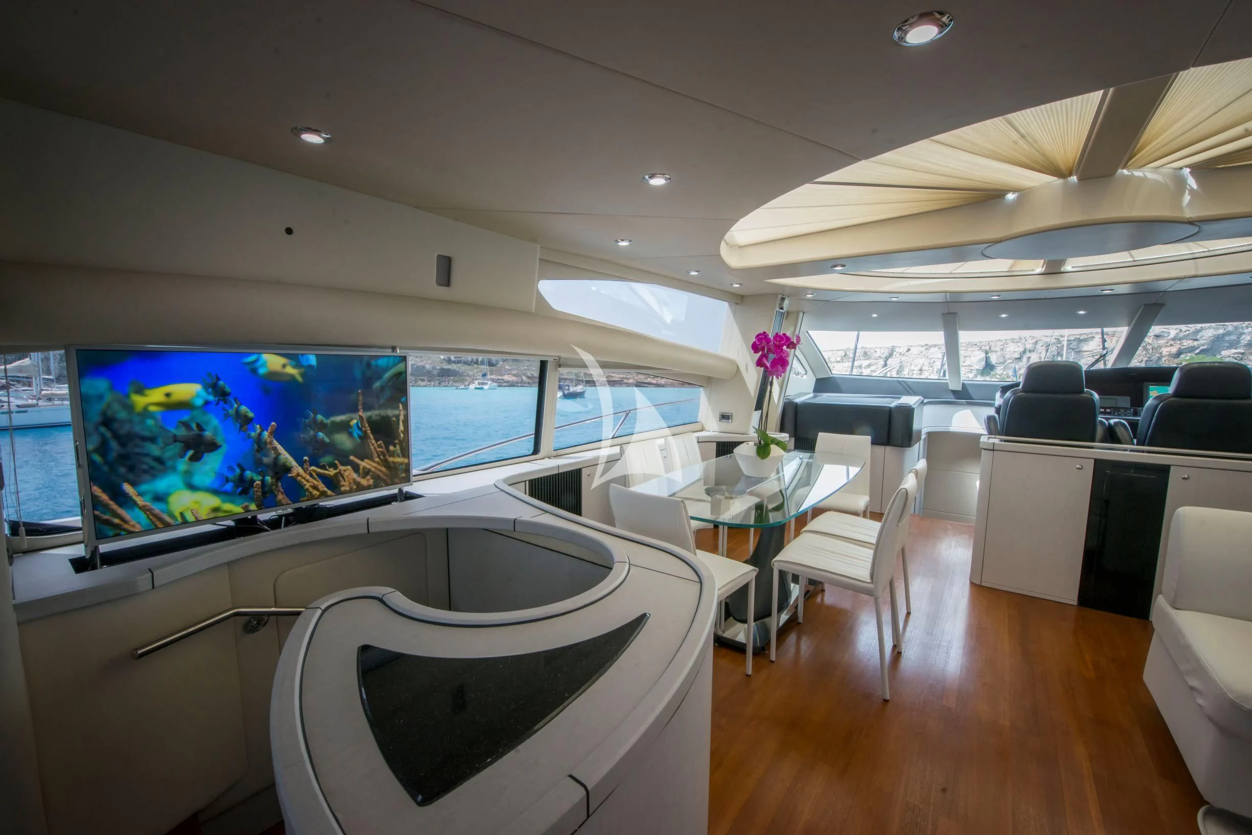 a room with a table and chairs aboard LIGHT BLUE Yacht for Sale