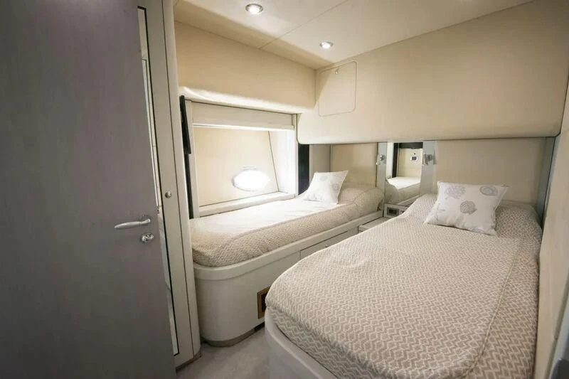 a room with two beds aboard LIGHT BLUE Yacht for Sale