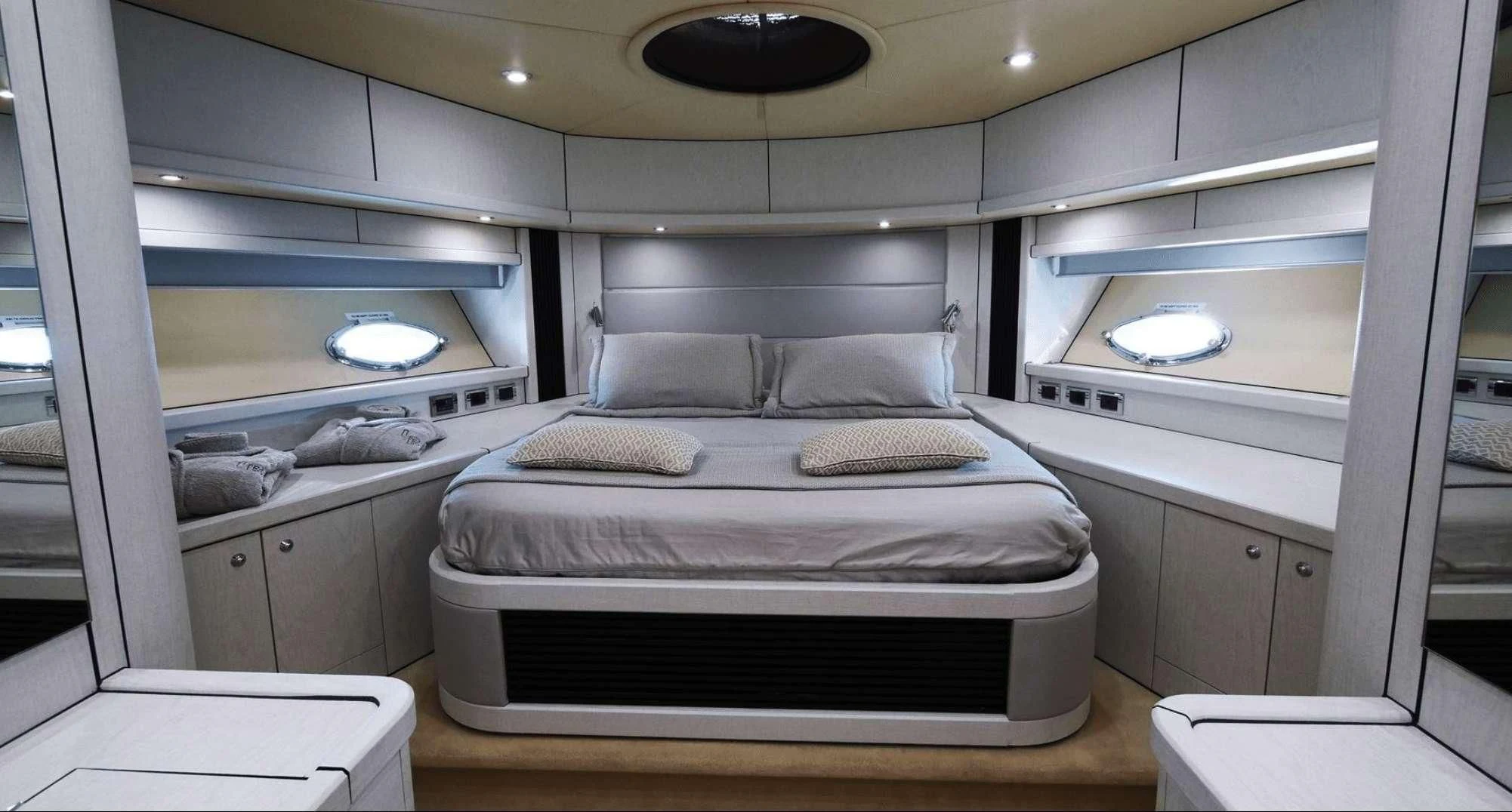 a room with a bed and a window aboard LIGHT BLUE Yacht for Sale