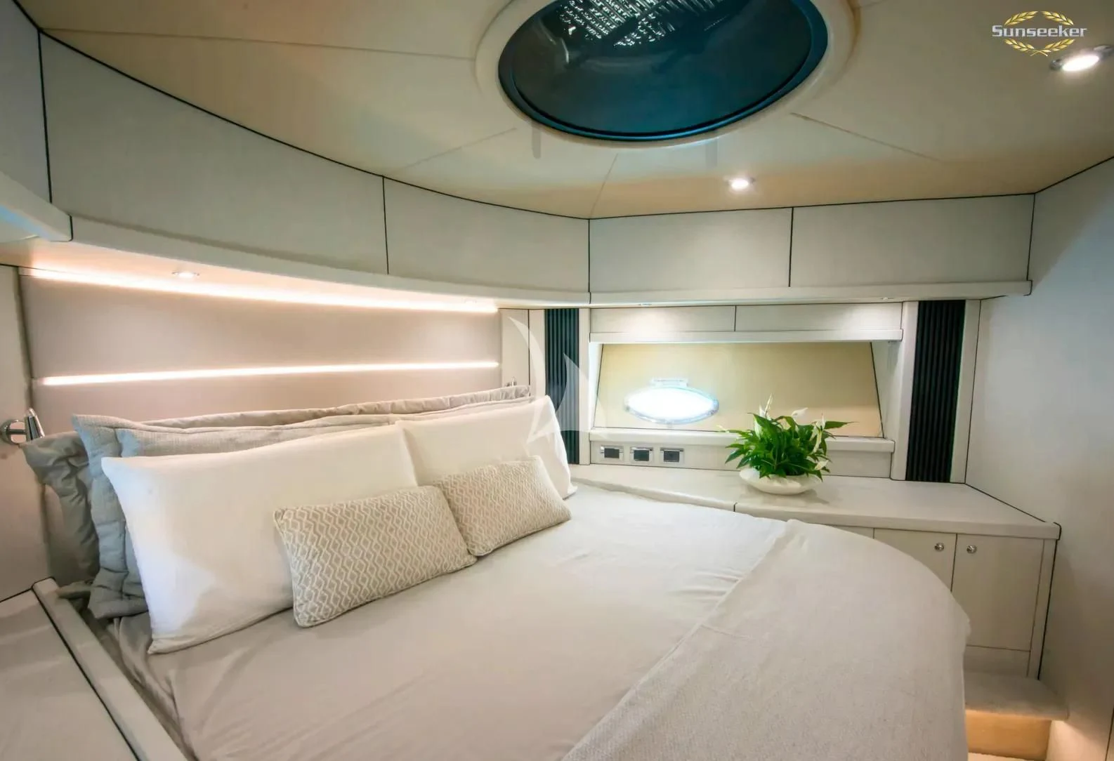 a white bedroom with a large bed aboard LIGHT BLUE Yacht for Sale