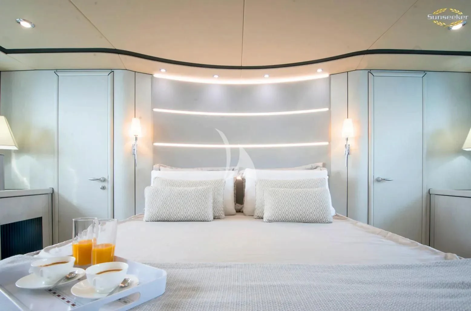 a bed with white sheets and pillows aboard LIGHT BLUE Yacht for Sale