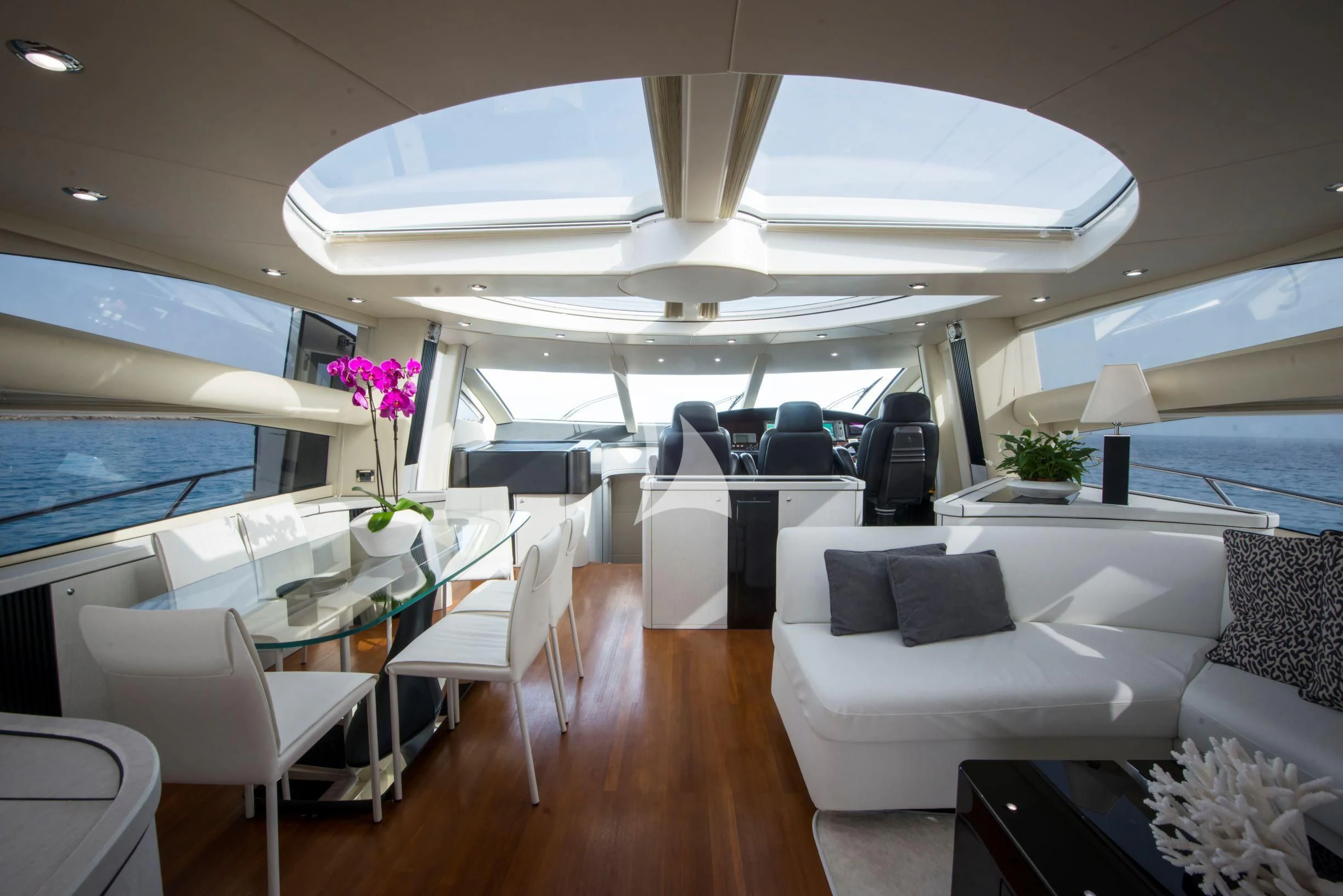 a room with a table chairs and a couch aboard LIGHT BLUE Yacht for Sale