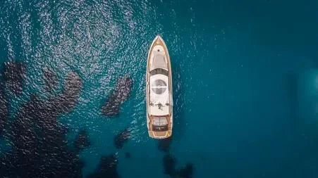 a white boat in the water aboard LIGHT BLUE Yacht for Sale