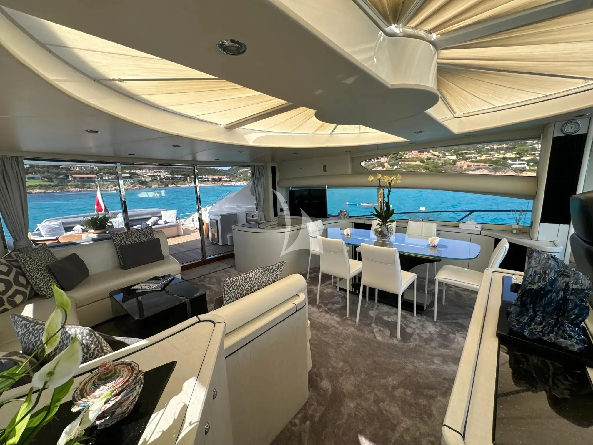 a room with a table and chairs aboard LIGHT BLUE Yacht for Sale