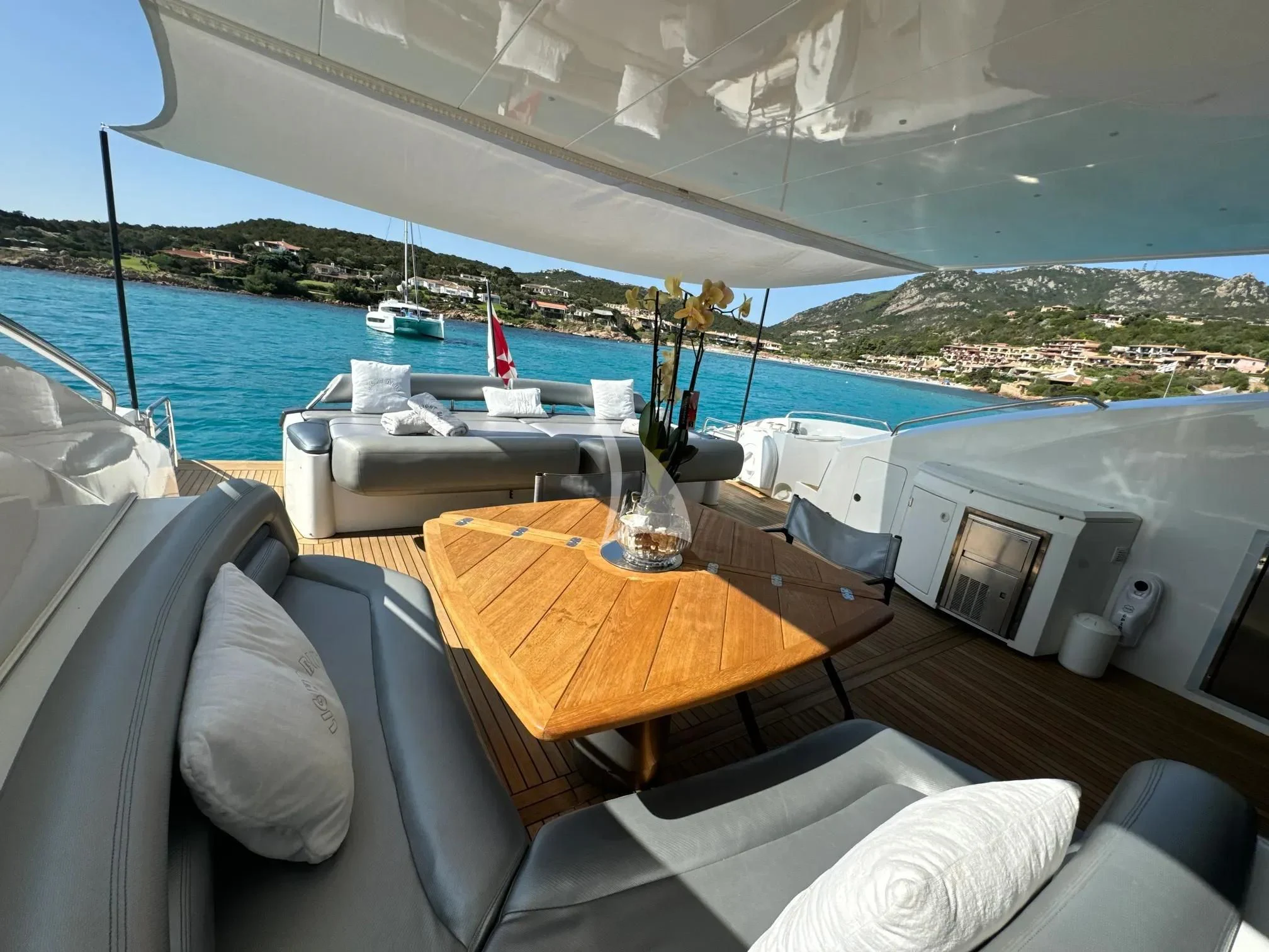 a room with a table and chairs aboard LIGHT BLUE Yacht for Sale