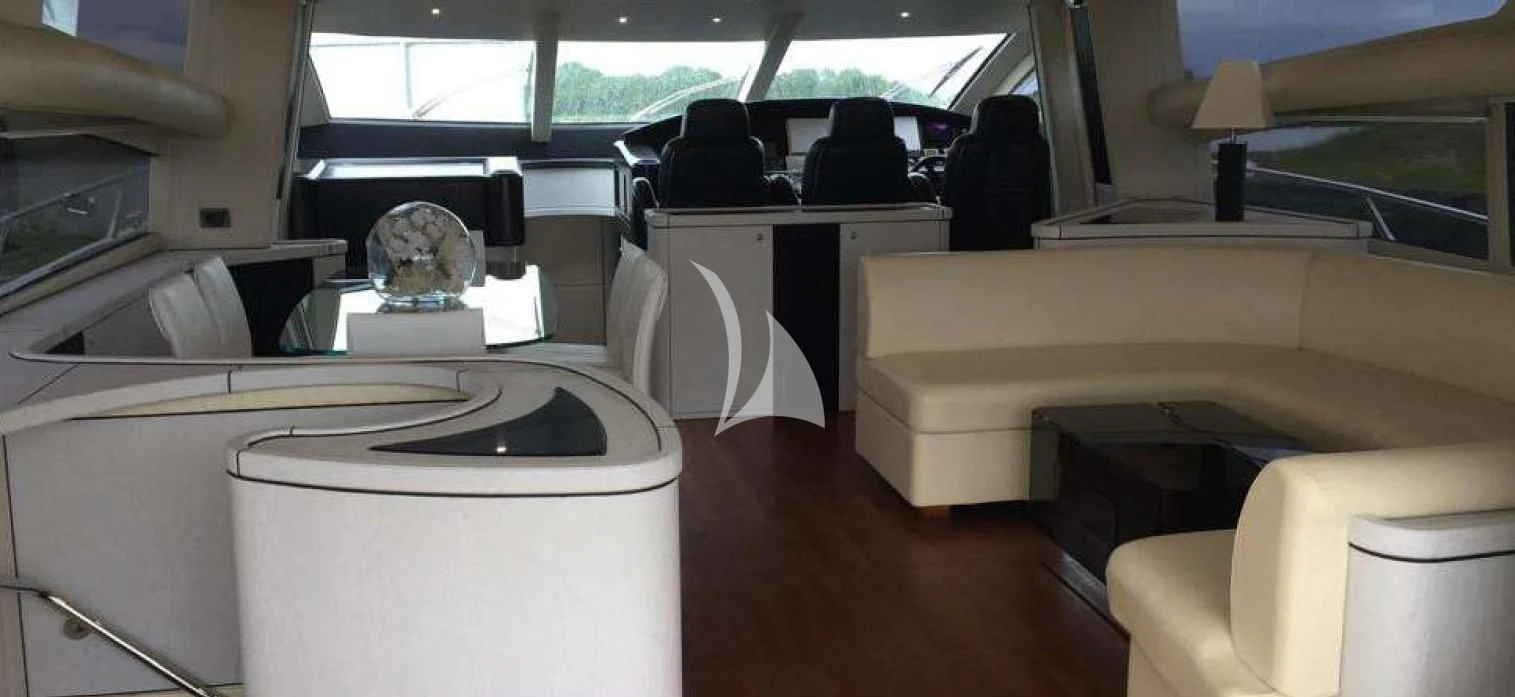 a room with a fan and chairs aboard LIGHT BLUE Yacht for Sale