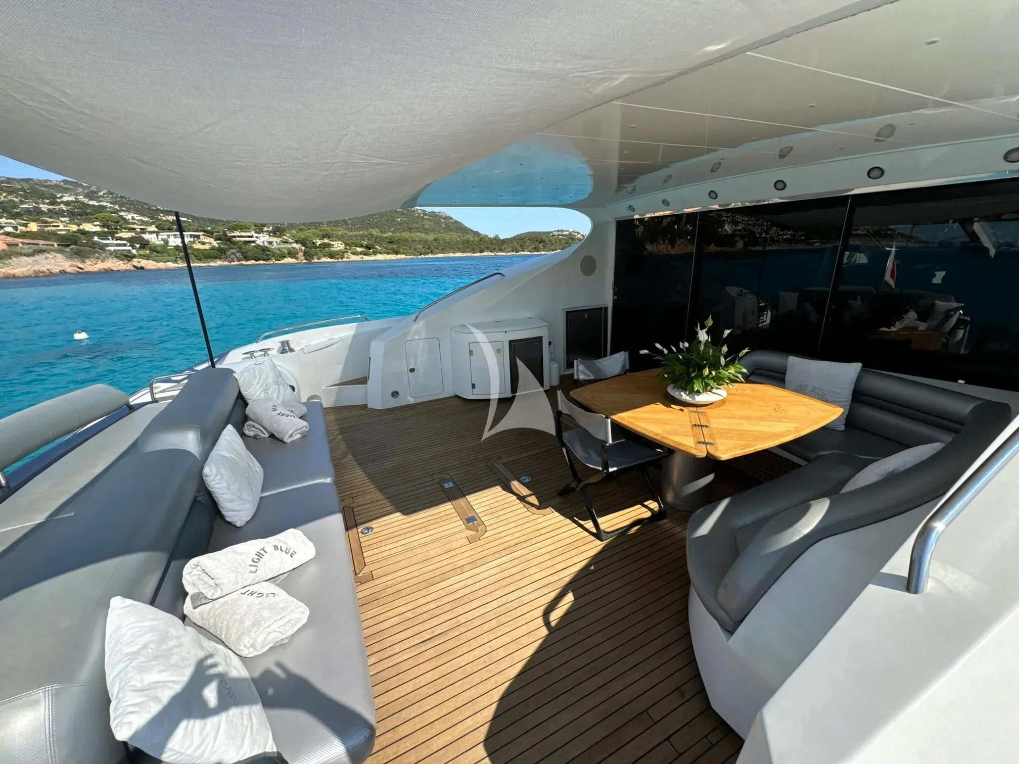 a room with a table chairs and a large body of water aboard LIGHT BLUE Yacht for Sale