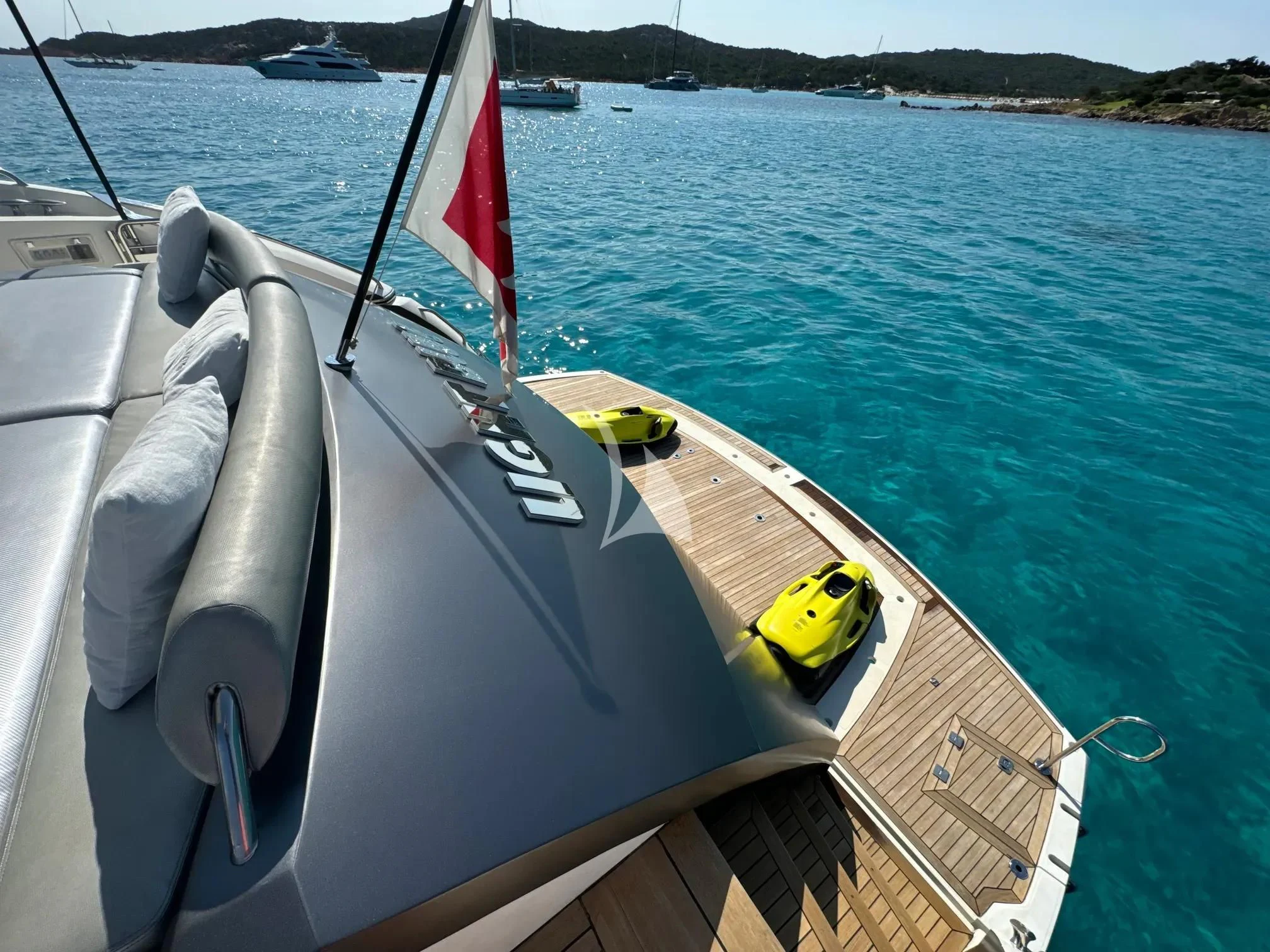 a boat with a flag on the front aboard LIGHT BLUE Yacht for Sale