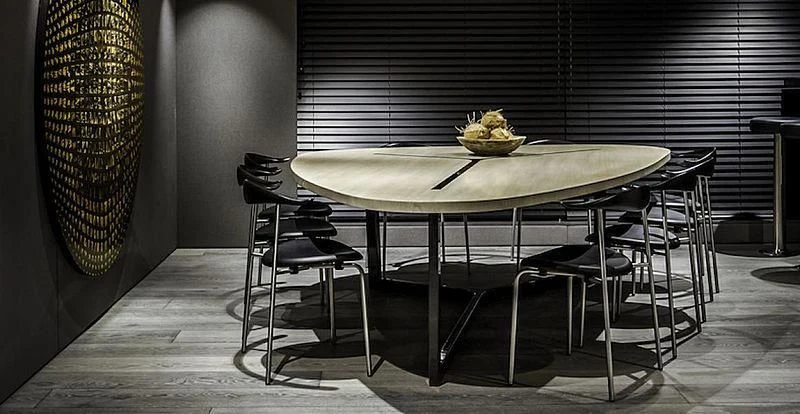 a table and chairs in a room aboard THE BEAST Yacht for Sale