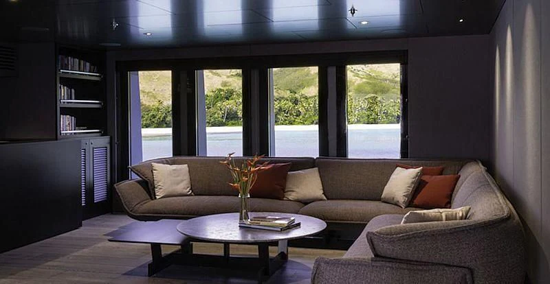 a living room with a couch and a coffee table aboard THE BEAST Yacht for Sale