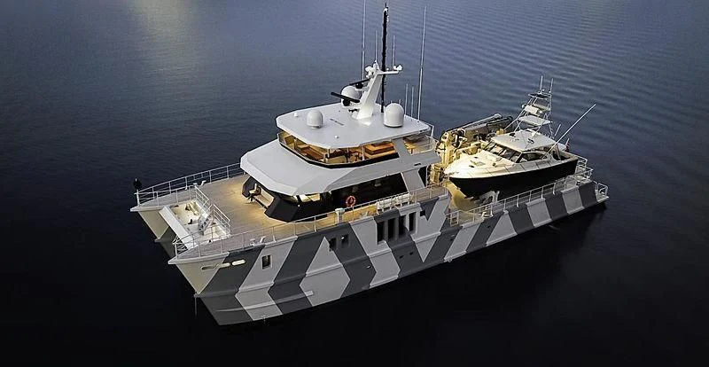 a couple of military ships in the ocean aboard THE BEAST Yacht for Sale