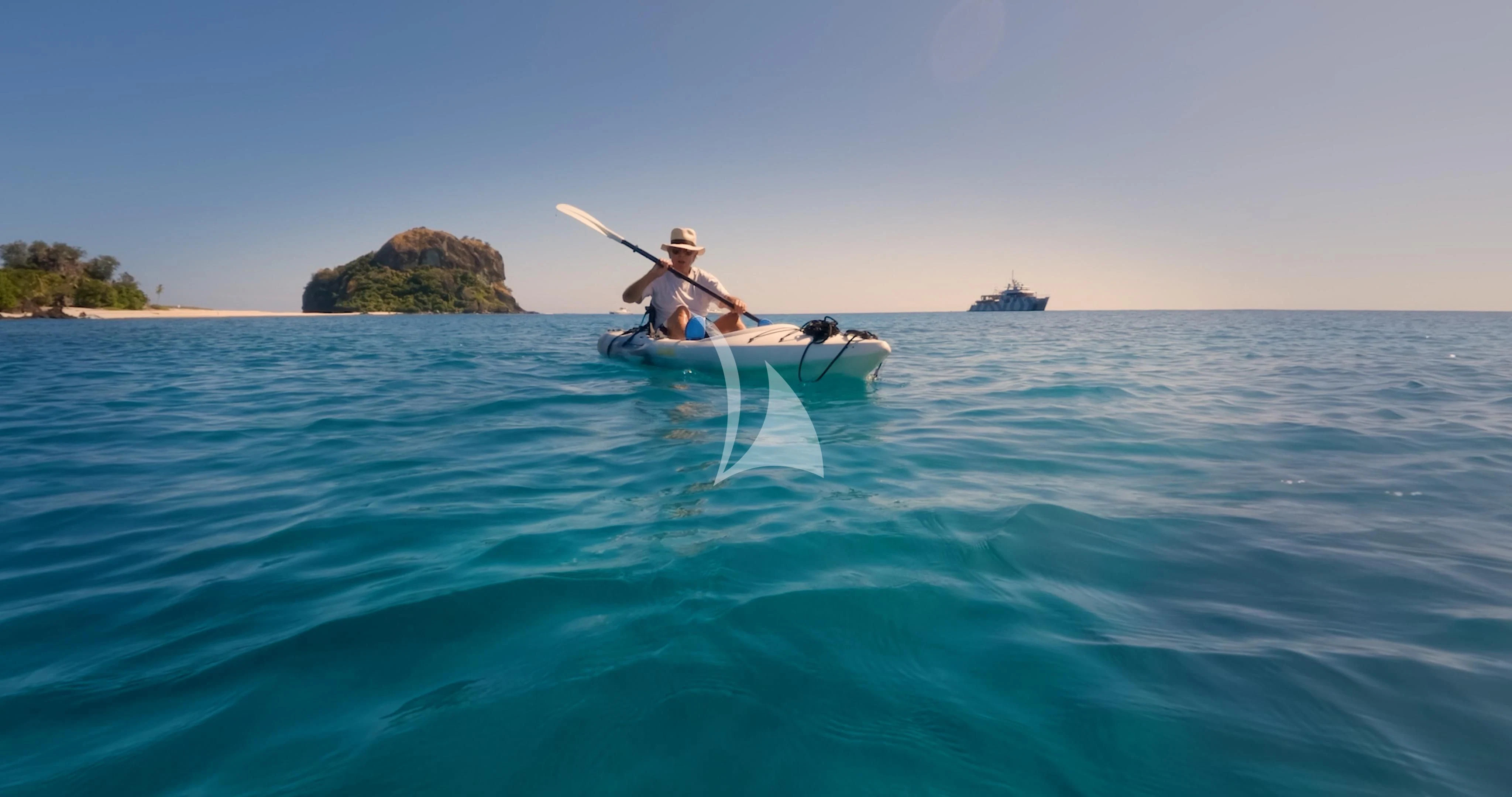 a man in a boat on the water aboard THE BEAST Yacht for Sale