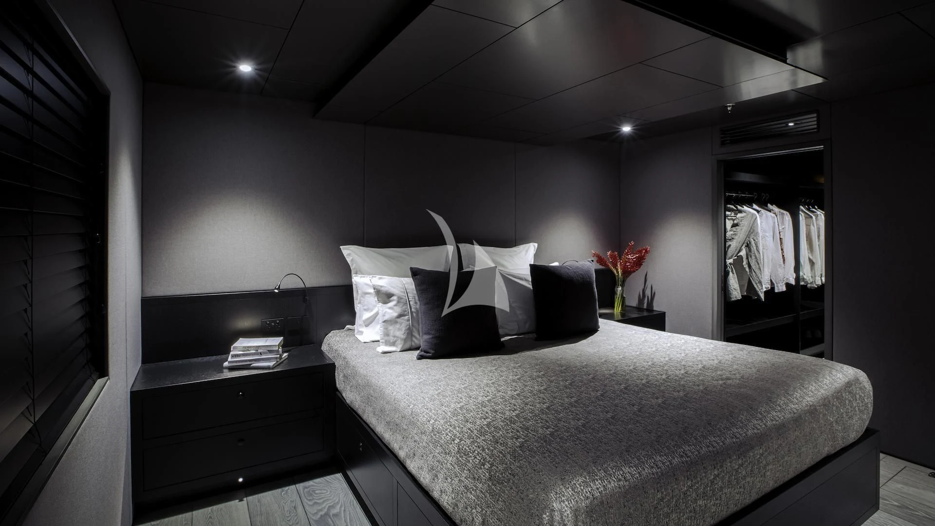 a bed with white sheets and pillows aboard THE BEAST Yacht for Sale