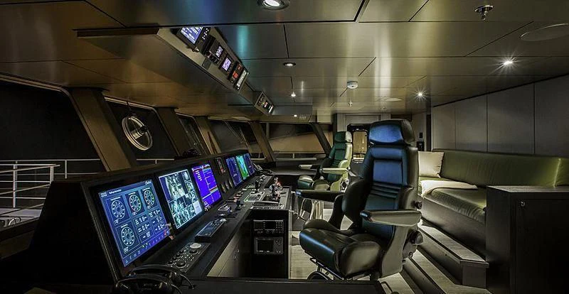 a room with many computers and chairs aboard THE BEAST Yacht for Sale