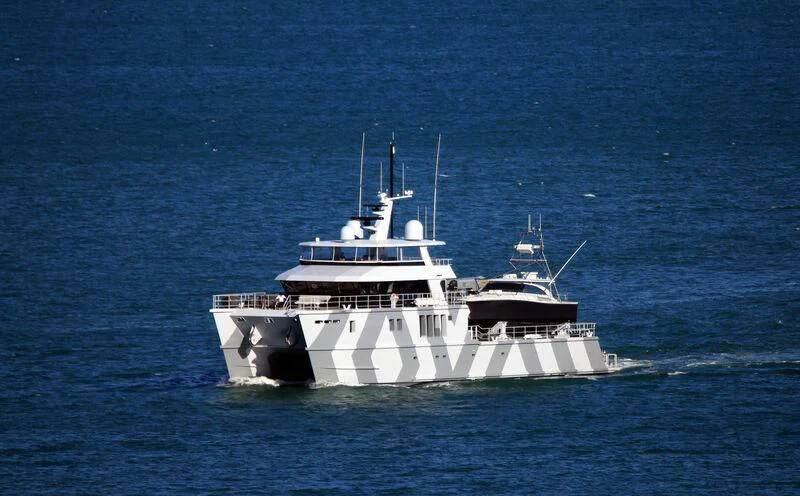 a large white boat in the water aboard THE BEAST Yacht for Sale