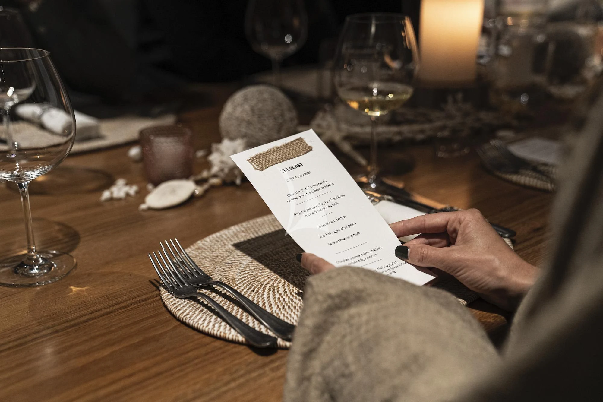 a person writing on a paper aboard THE BEAST Yacht for Sale